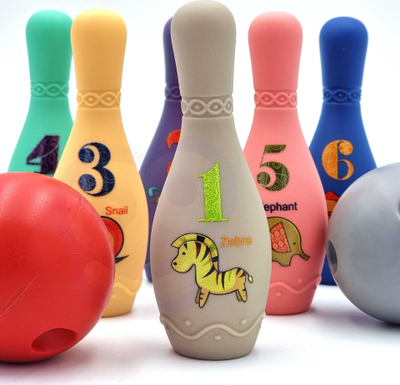 Lojë bowling sensorike Woopie Baby, 8 copë, plastike e butë, shumëngjyrëshe