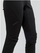 Pantallona sportive për goca Craft Glide FZ, softshell, me zinxhir anash, të zeza