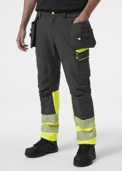 Pantallona pune Helly Hansen Workwear ICU BRZ CONS hi viz CL1, shtrirje 4-way, me shirita reflektues, verdhë me të zezë