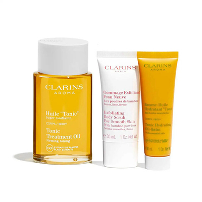 Set dhuratë Clarins Rituale Huile Tonic, vaj 100 ml + skrab 30 ml + balsam 30 ml 