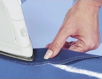 Pluhur ngjitës për tekstil Wenko Fabric Fix, për riparim rrobash, transparent