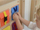 Panel edukativ Masterkidz Pockets, dru 46cm, xhepa me mbyllje, shumëngjyrësh