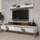 Kabinet TV Kalune Design September, me rafte, këmbë druri, e bardhë