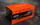 Maket makine F1 Bburago McLaren MCL60 2023 Oscar Piastri, shkalla 1:43, me helmetë, portokalli e zezë