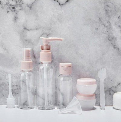 Set shishesh udhëtimi me çantë kozmetike, 8 copë, transparente