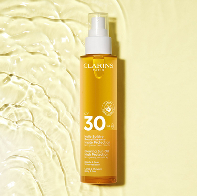 Масло за сонце Clarins Glowing Sun Oil, висока SPF заштита, тело и коса, 150ml