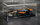Maket makine F1 Bburago McLaren MCL60 2023 Oscar Piastri, shkalla 1:43, me helmetë, portokalli e zezë