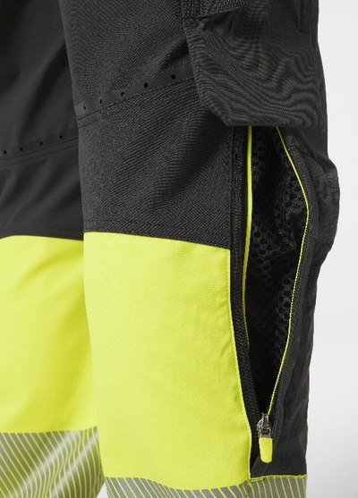 Pantallona pune Helly Hansen Workwear ICU BRZ CONS hi viz CL1, shtrirje 4-way, me shirita reflektues, verdhë me të zezë