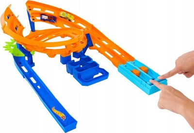Set pistash garash Hot Wheels Whip Around Raceway, 2 makina 1:64, paloset për me e fut kollaj, shumëngjyrësh