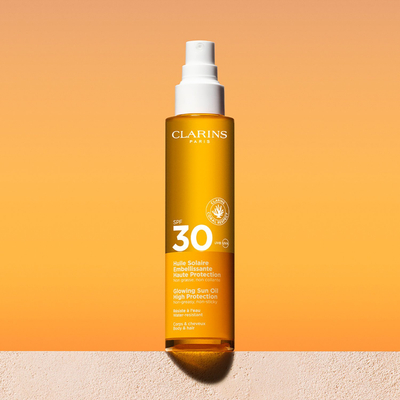 Масло за сонце Clarins Glowing Sun Oil, висока SPF заштита, тело и коса, 150ml