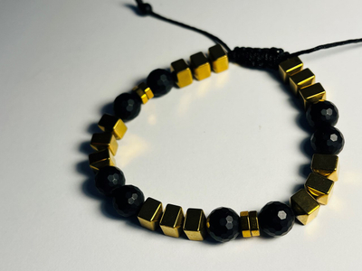 Byzylyk për meshkuj Dar Golden Hematite, i zi/artë