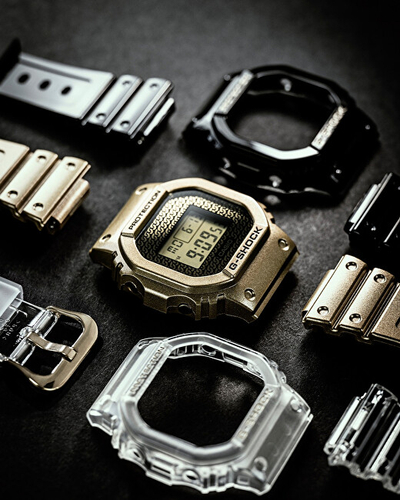 Set orë digjitale Casio G‑SHOCK The Origin DWE-5600HG-1ER (322) + rrip ore, e artë/e zezë/e bardhë