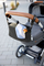 Çantë organizuese për karrocë Lässig Buggy Organizer, me grepa fiksimi, e zezë