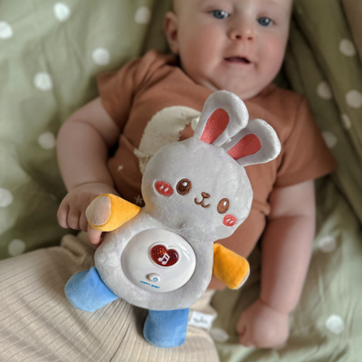 Lodër pelushi për kalamiaj WOOPIE BABY Bunny, me dritë edhe tinguj gjumi, rozë
