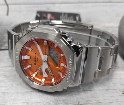 Ora dore Casio G-Shock Metal Steel Edition, 44.4mm, cadran portokalli, rrip metalik argjendtë