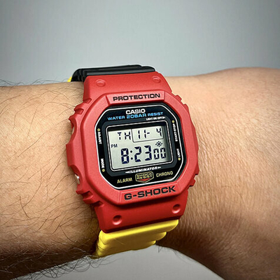 Orë dore për meshkuj Casio G-Shock x J Balvin DWE-5600R-9ER, e verdhë