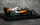 Maket makine F1 Bburago McLaren MCL60 2023 Oscar Piastri, shkalla 1:43, me helmetë, portokalli e zezë