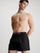 Shorce noti për meshkuj Calvin Klein, të zeza