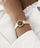 Orë dore për femra Guess Mini Rumour GW0839L2, e artë