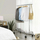 Varese rrobash SONGMICS HSR11S, kapacitet 130 kg, i rregullueshëm 110-150 cm, argjendtë