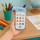 Telefon lodër edukativ Unicorno Interactive Phone, me drita dhe melodi, për fëmijë, i kaltër
