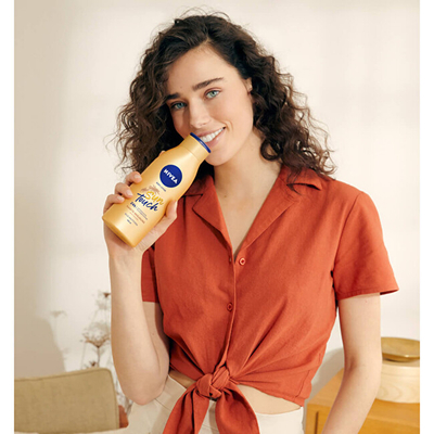 Losion për nxirje Nivea Sun Touch, 400 ml