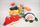 Lodër pelushi BumBumz Shah Sushi Roll, 7.5", koleksion TakeoutBumz, shumëngjyrëshe