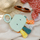 Играчка за бања Fehn Bath Book Octopus, водена книга за бебиња, со прстен за прицврстување, шарена
