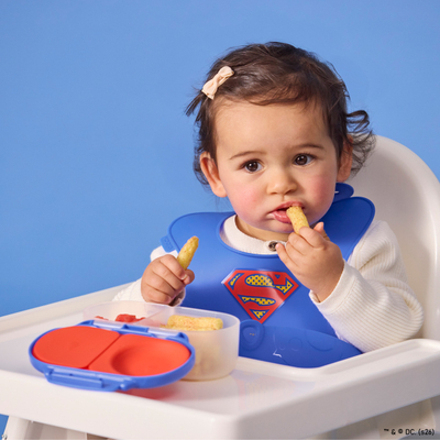 Babator silikon për bebe b.box Superman, xhep i thellë, i kaltër