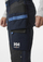 Pantallona pune Helly Hansen Workwear Oxford 4X Stretch, me xhepa t’varur, të përforcuar te gjunjët, blu e errët me të zeza C46