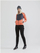 Pantallona sportive për goca Craft Glide FZ, softshell, me zinxhir anash, të zeza