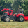 Traktor lodër me pedale Case IH Puma 240 CVX FA996AM, me ngarkues dhe rimorkio, i kuq